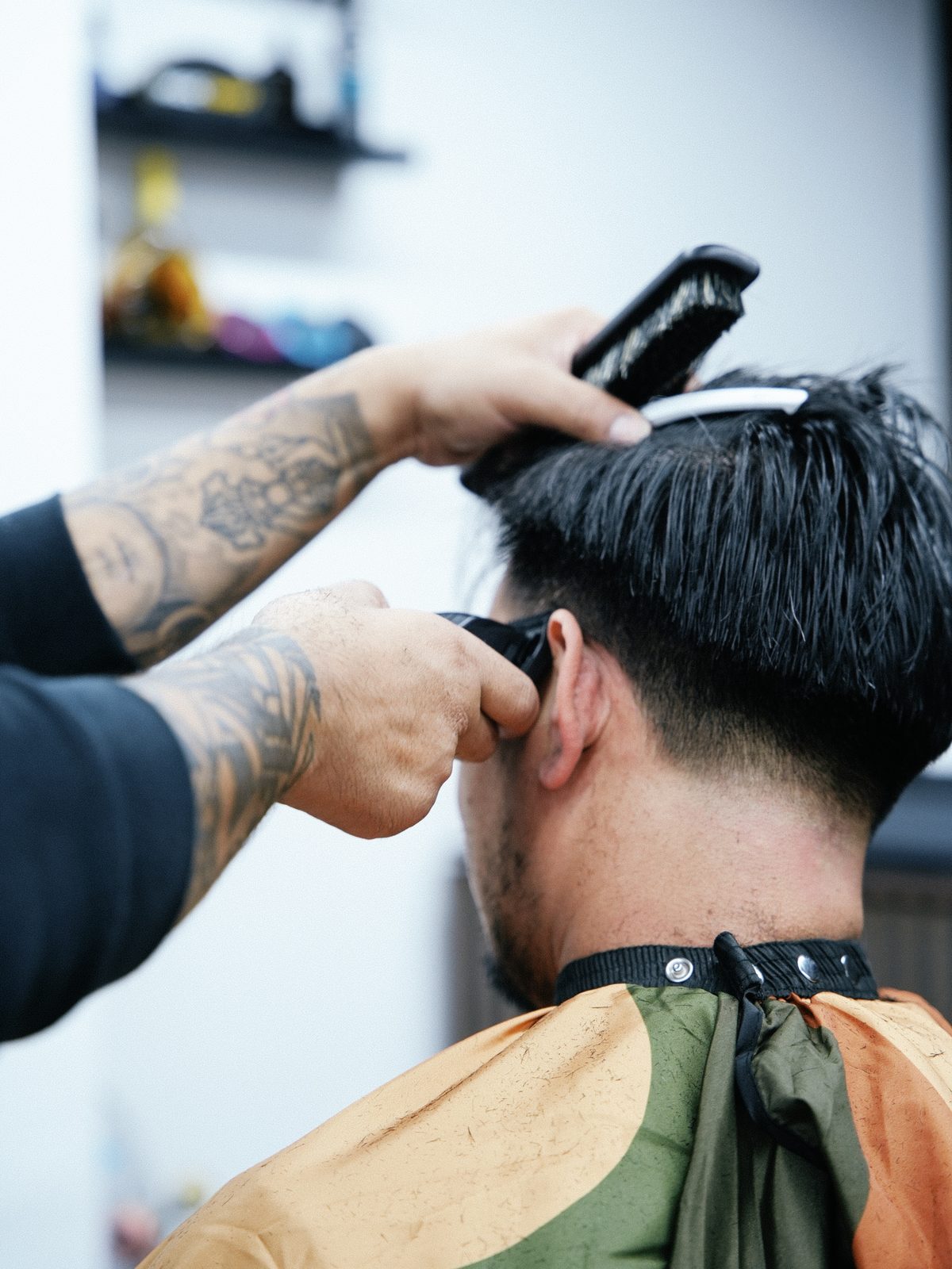 Barber clipping hair at Fat Fade GU14